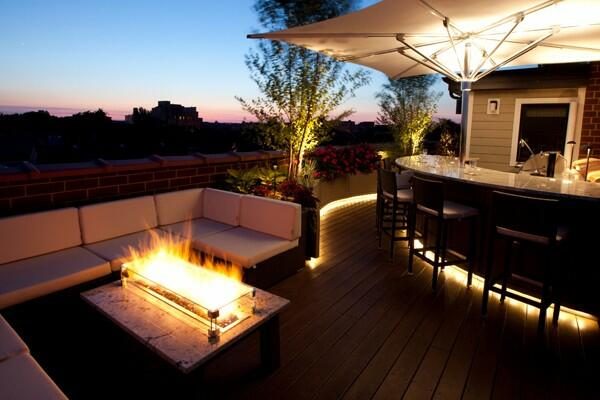 propane fire pit next to bar outside